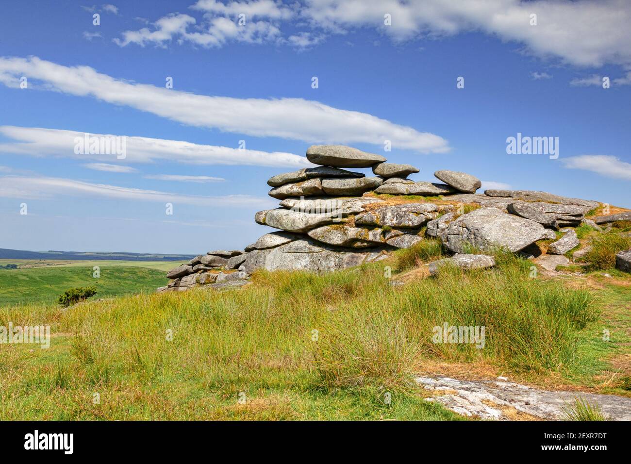 Granite tor on Stowe's Hill, Bodmin Moor, Cornwall, UK, under a spectacular summer sky. Bodmin Moor is a location in the TV series Poldark. Stock Photo