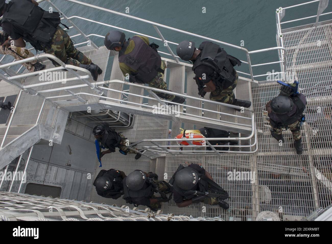 Nigerian sailors with the Special Boat Service and Cameroonian soldiers with the Rapid Intervention Battalion conduct a simulated boarding aboard the joint high speed vessel USNS Spearhead (JHSV 1) in the Gulf of Guinea April 20, 2014, during Obangame Express 2014. Obangame Express is a maritime exercise conducted by U.S. Naval Forces Africa to improve cooperation among African partner nations in order to increase safety and security in the Gulf of Guinea. (Photo by Mass Communication Specialist Seaman Justin R. DiNiro, U.S. Navy/DoD/Sipa USA) Stock Photo