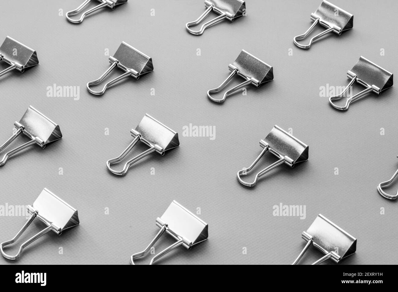 Paper binder clips. Stationery and office supplies background Stock Photo -  Alamy