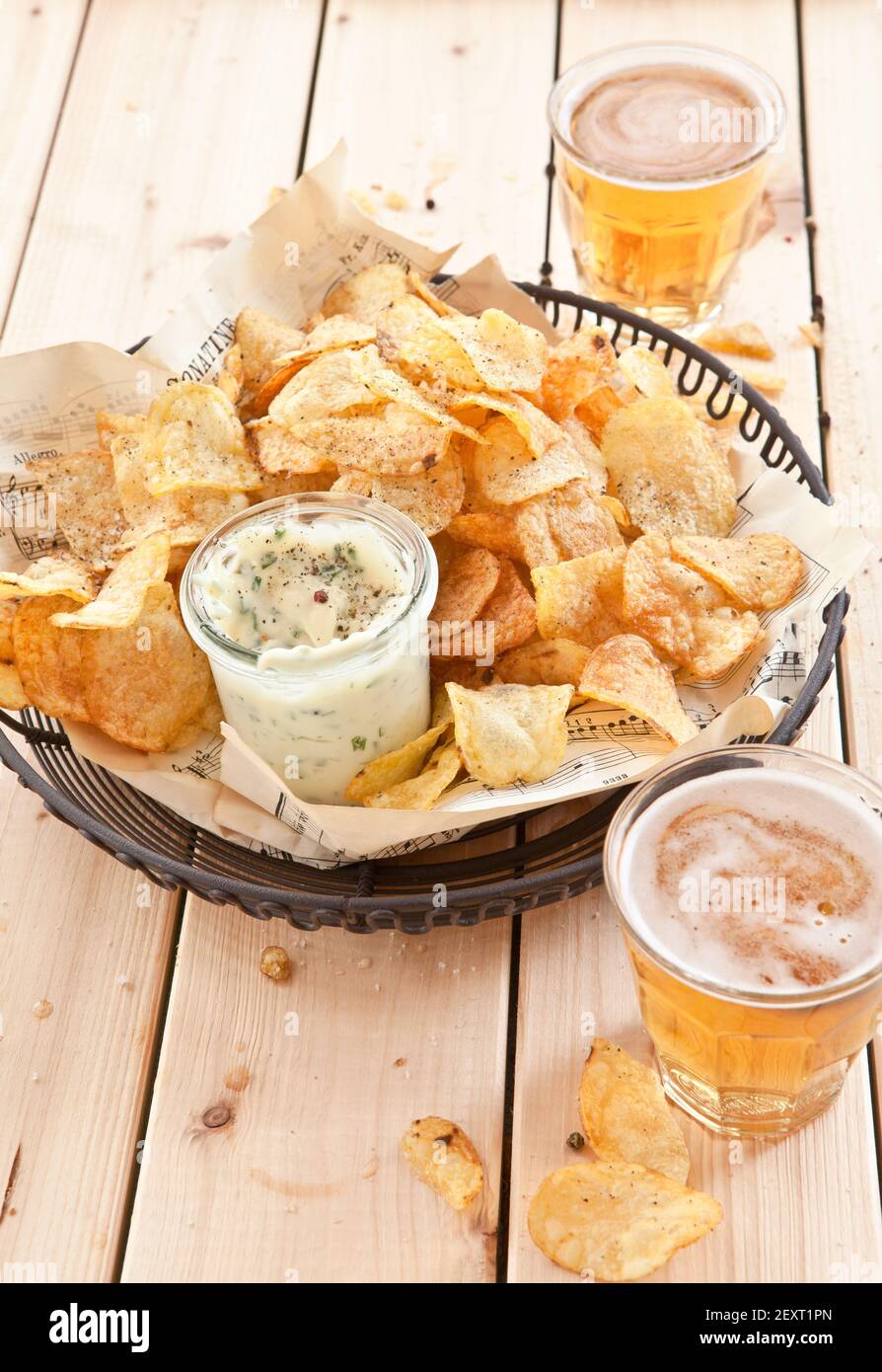 Vintage wire basket with chips and beer Stock Photo Alamy