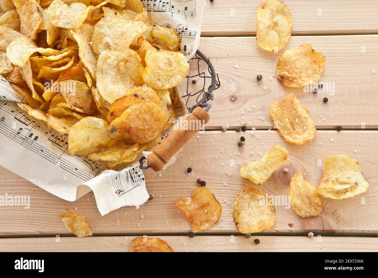 Vintage wire basket with chips Stock Photo Alamy