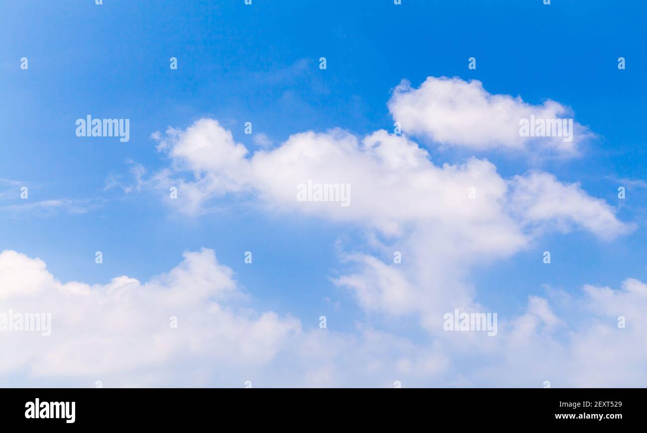 Natural background photo of blue sky with white cumulus clouds on a ...
