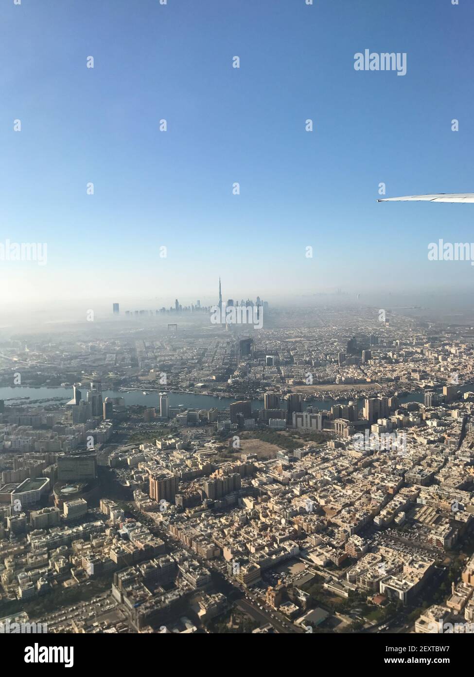 An aerial view of the beautiful city of Dubai under the blue sky from ...