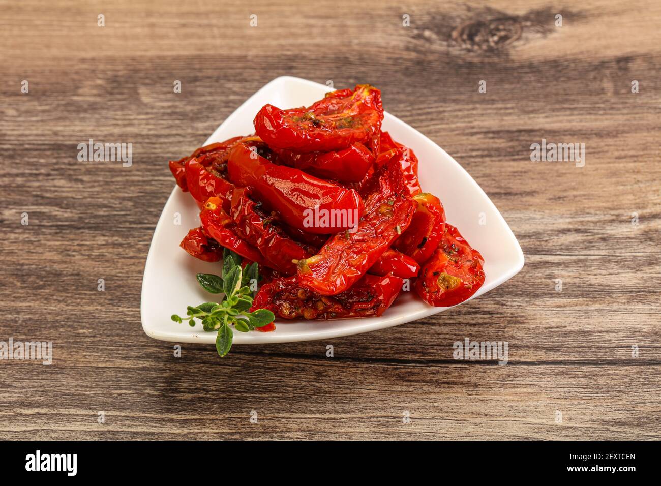 Sundried tomato in olive oil with herbs and spices Stock Photo Alamy
