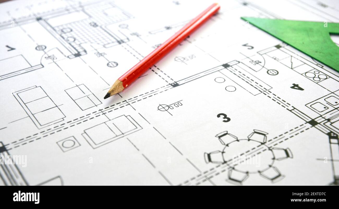 A close-up of a house plan, floor plan, house design with a living room. Drawing a home floor plan, design project using a pencil and a ruler. Stock Photo