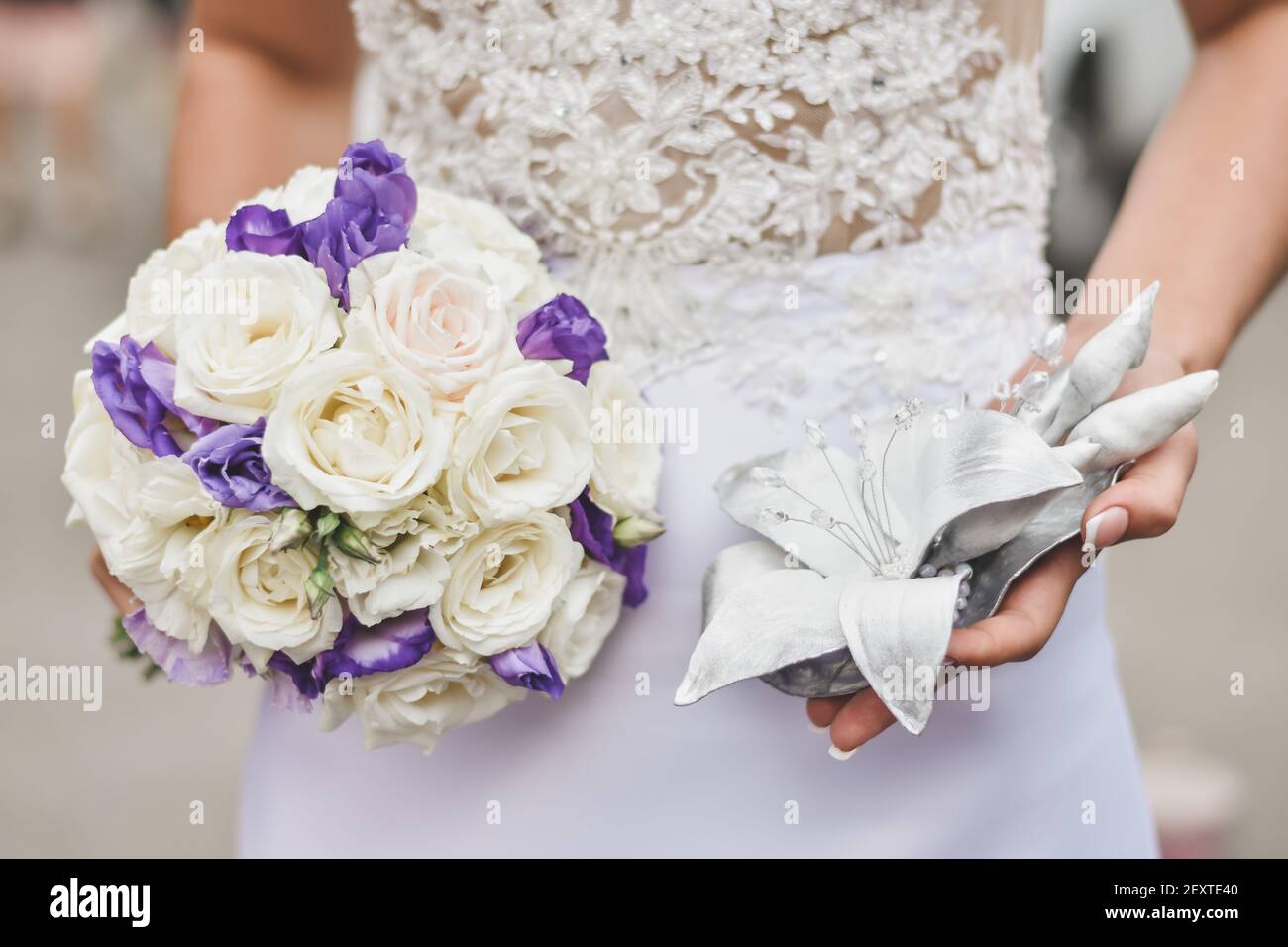 The bride holds a bouquet of flowers in her hands Stock Photo - Alamy