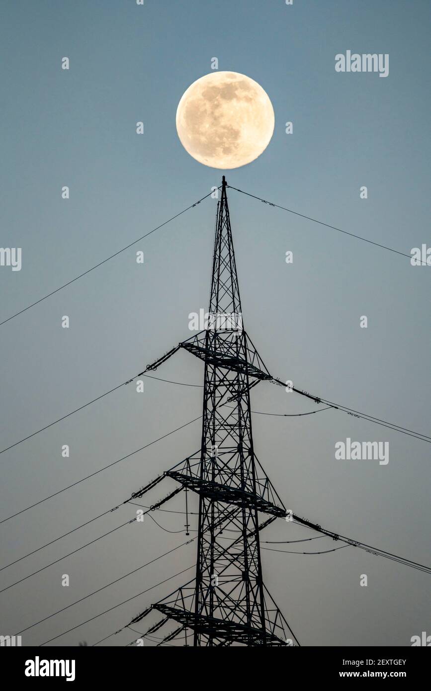 Full moon, high voltage pylon, transmission line pylon, Germany Stock ...