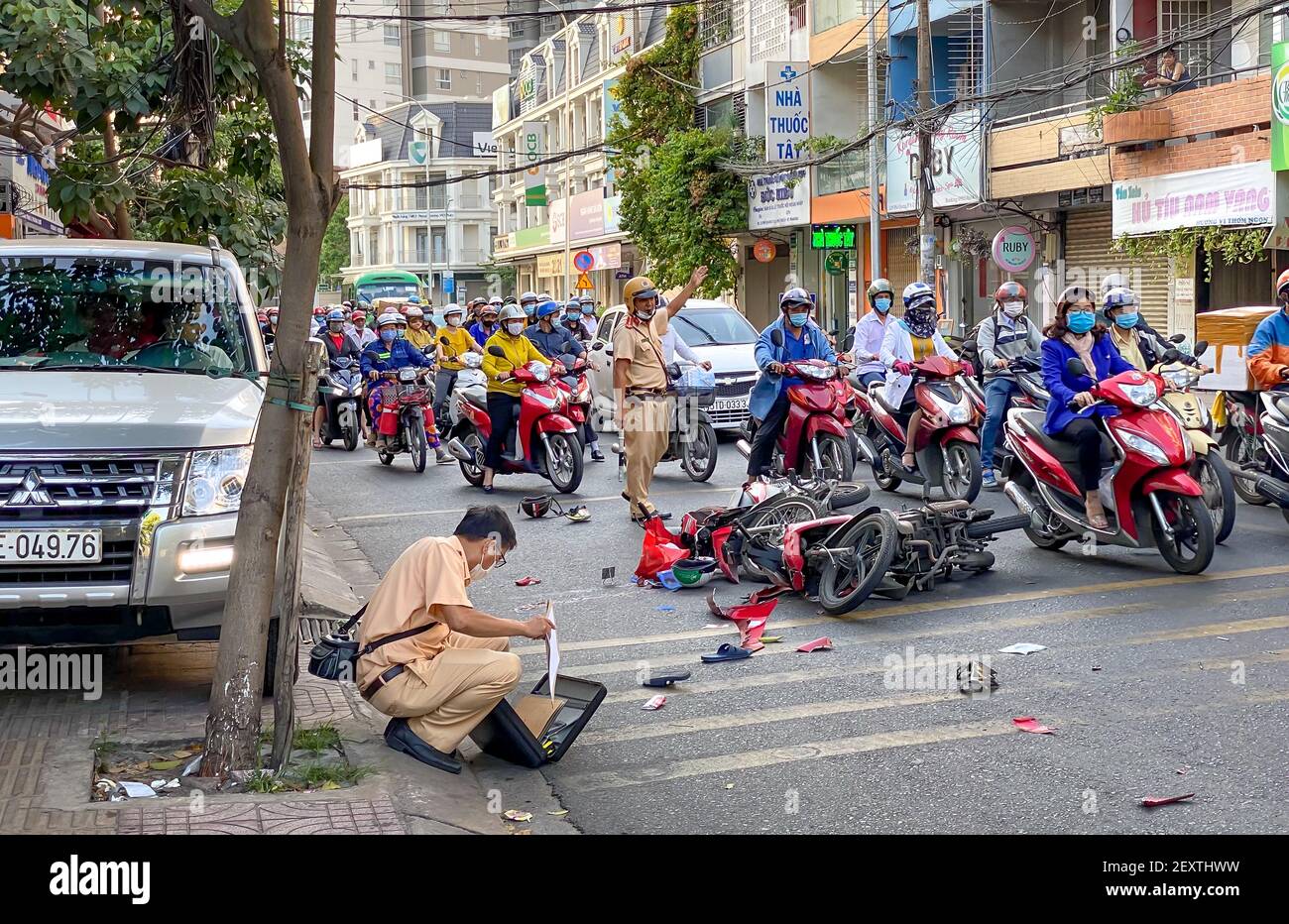 Pho Quang Street, Tan Binh District, Ho Chi Minh City, Vietnam - March 4, 2021: A traffic accident between two motorcycles, the police are handling th Stock Photo