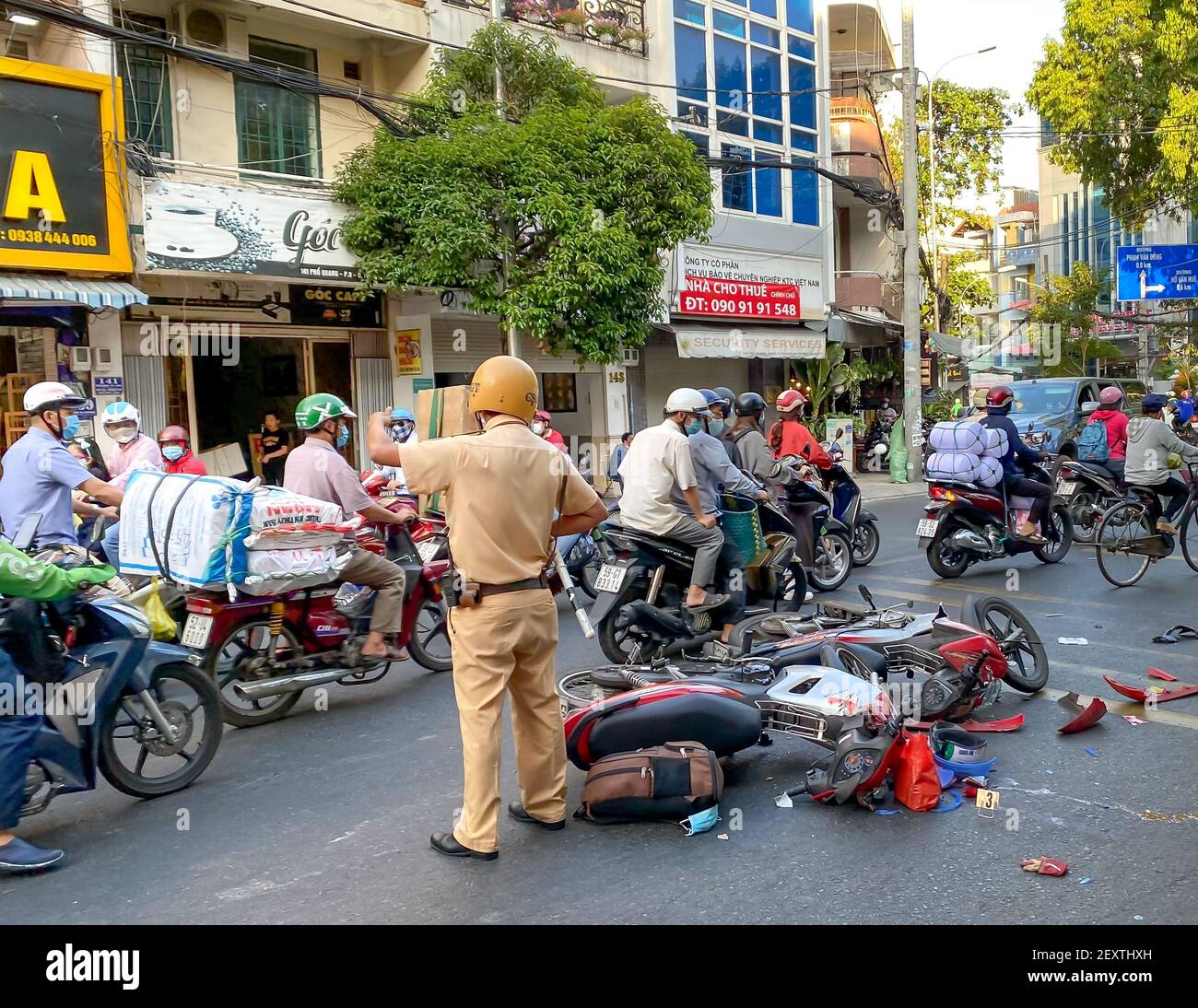 Pho Quang Street, Tan Binh District, Ho Chi Minh City, Vietnam - March 4, 2021: A traffic accident between two motorcycles, the police are handling th Stock Photo