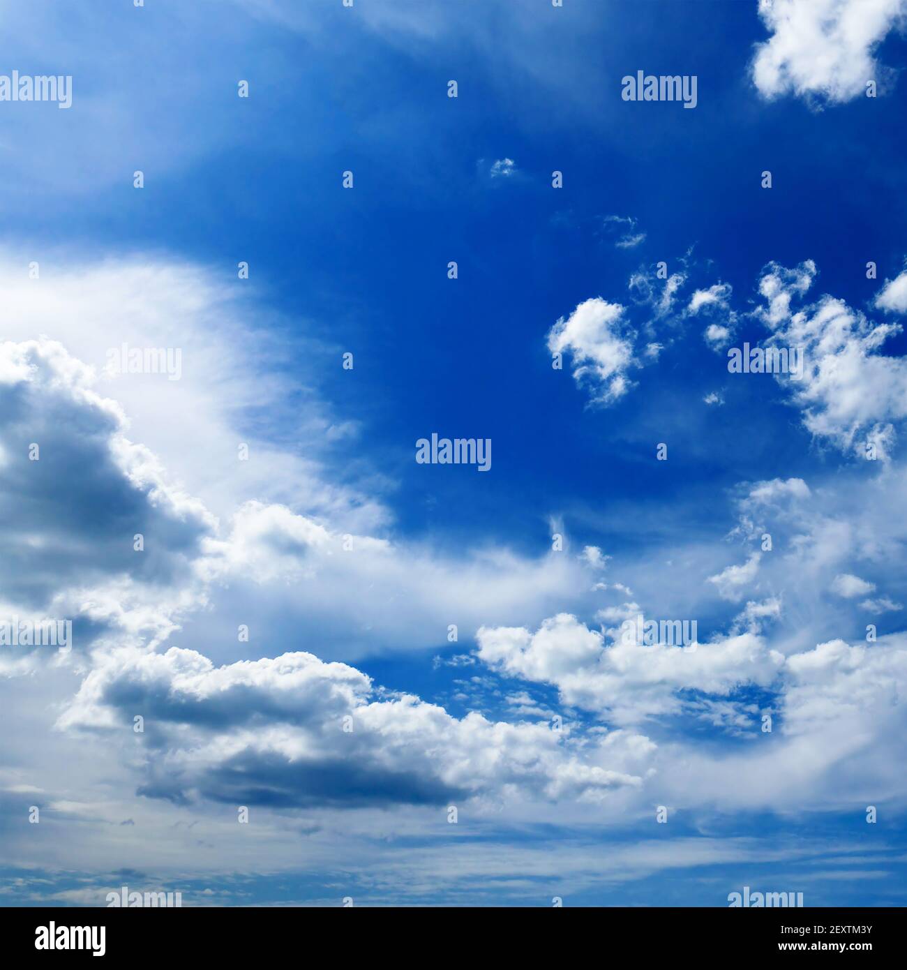 Beautiful white clouds on dark blue sky. Stock Photo