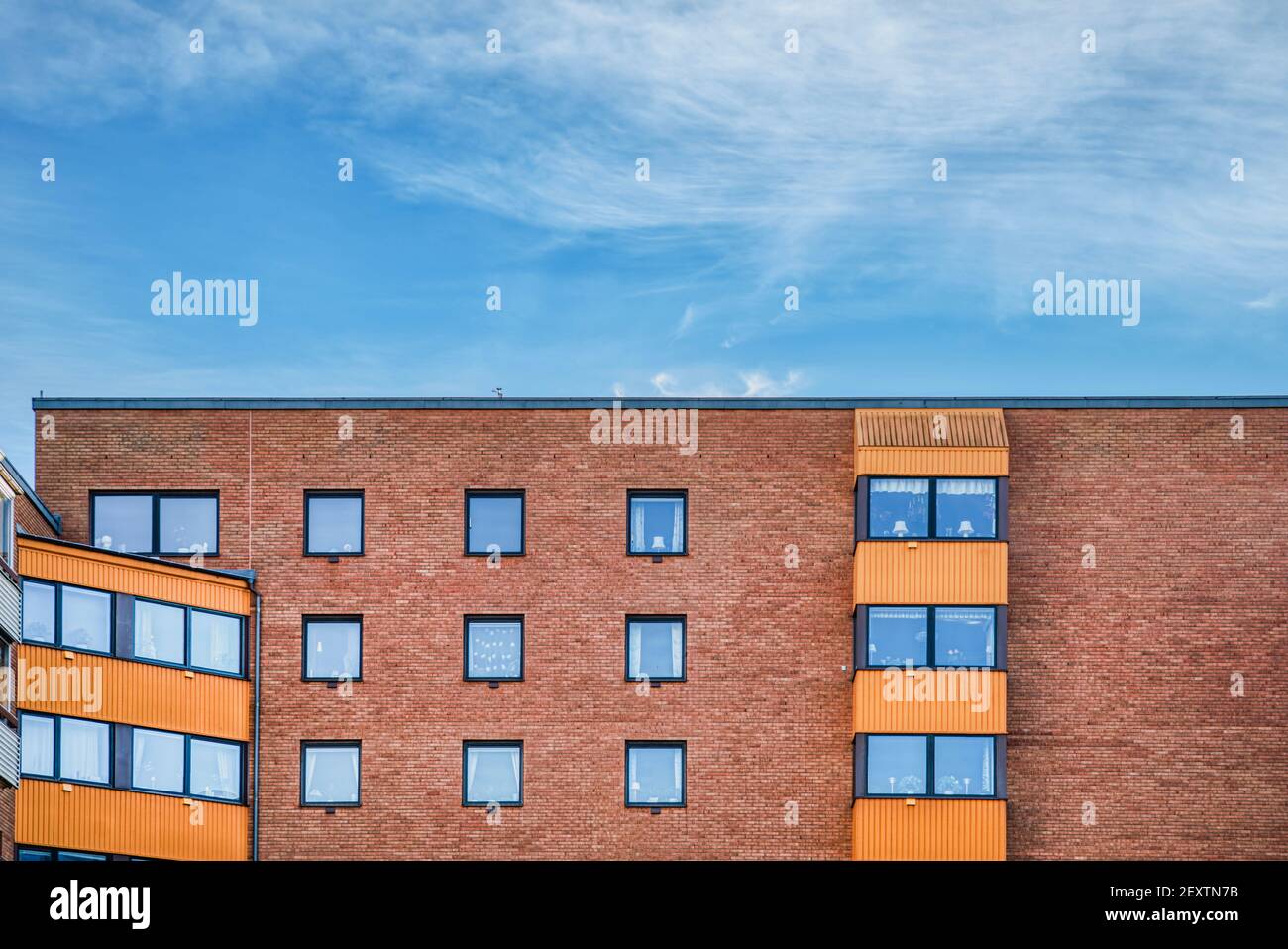 Brick wall upper part of a contemporary facade. The building consists ...