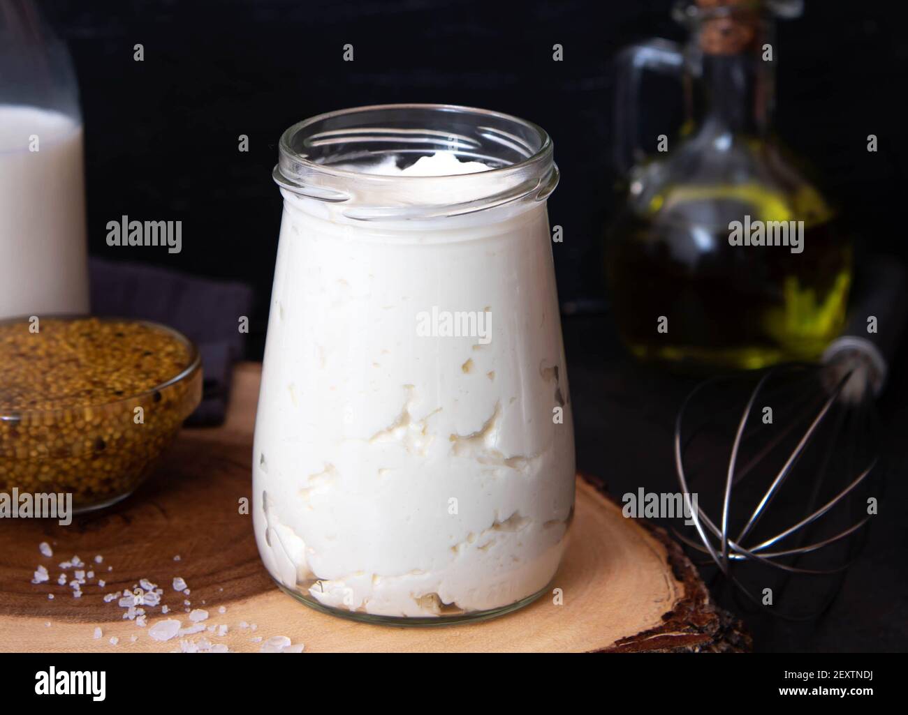Vegetarian mayonnaise. Ingredients for mayonnaise oil, milk and mustard. Homemade mayonnaise