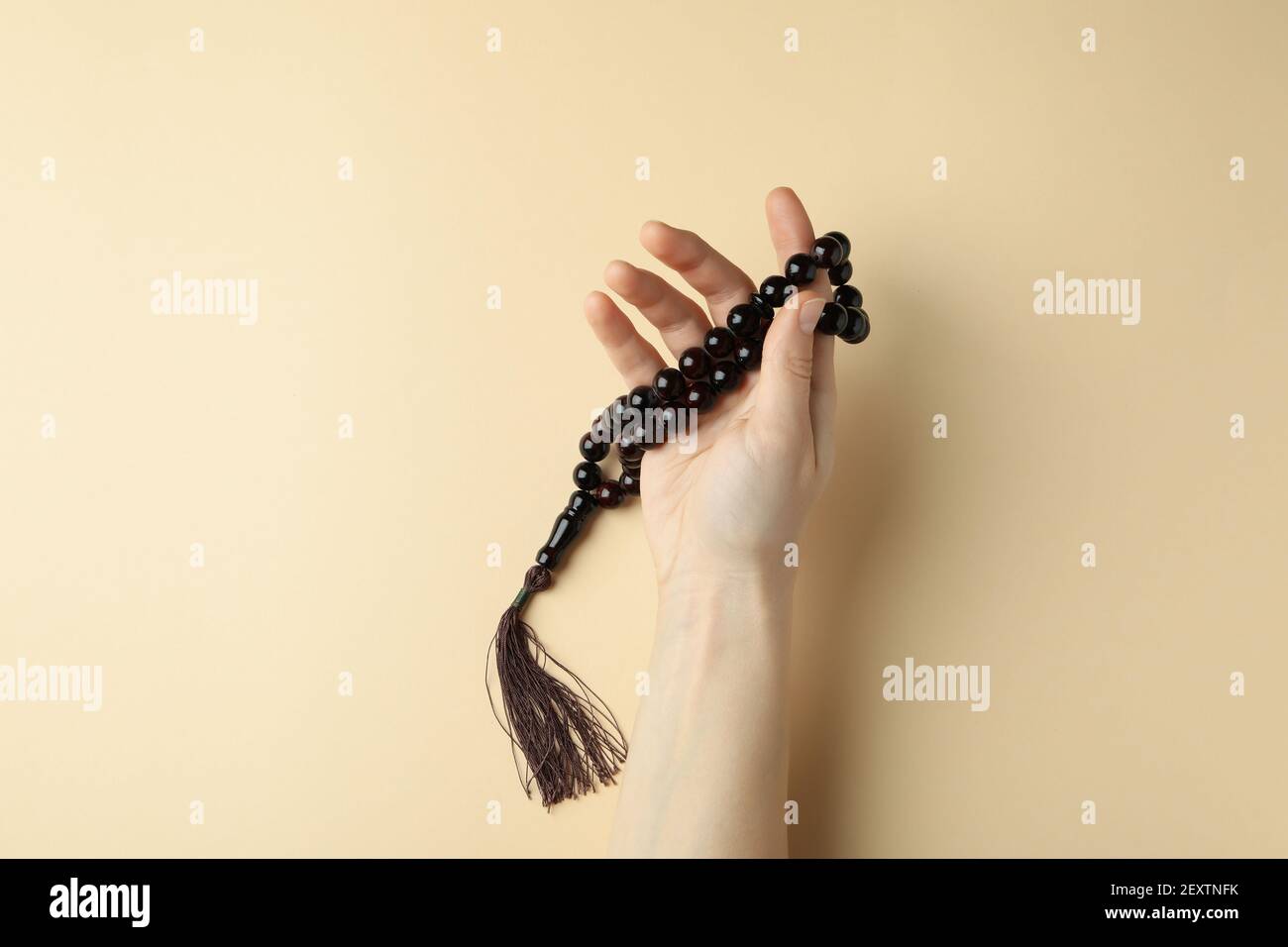 Muslim hand with prayer beads hi-res stock photography and images - Alamy