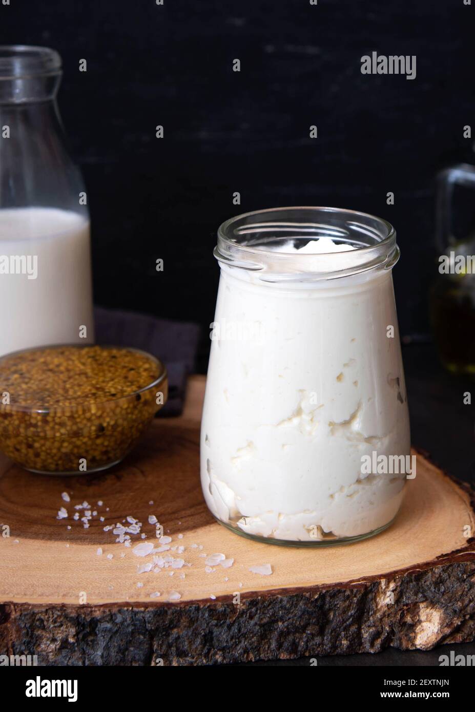Vegetarian mayonnaise. Ingredients for mayonnaise oil, milk and mustard. Homemade mayonnaise