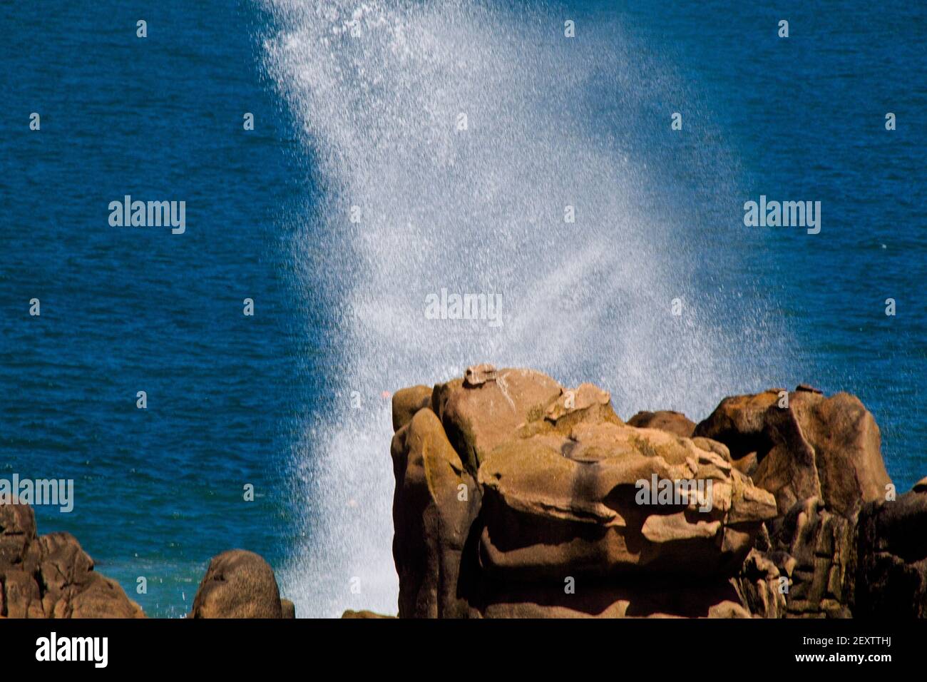 waves breaking on rocks Stock Photo