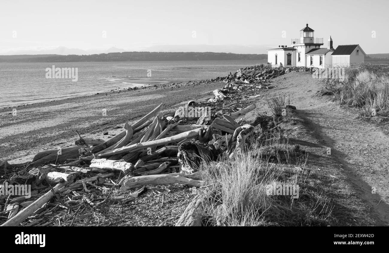 Driftwood Beach West Point Lighthouse Cape Jetty Discovery Park Seattle Stock Photo