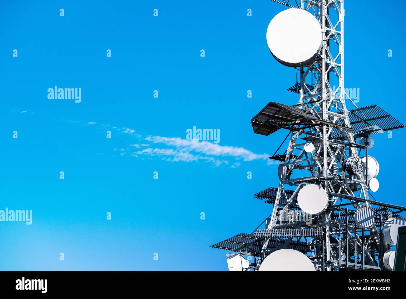 tower with television (TV), satellite and 5G antennas