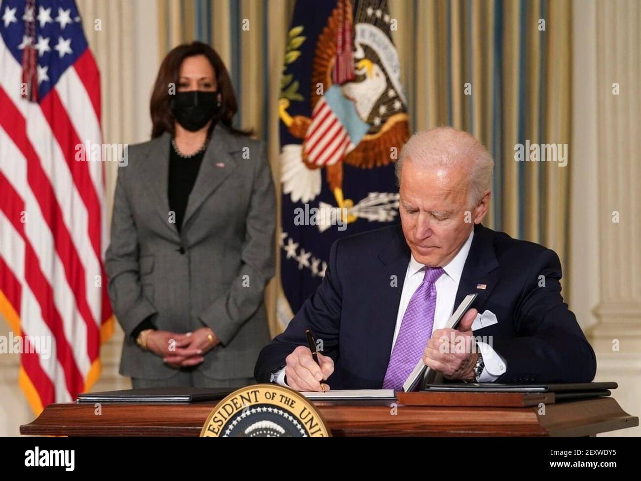 America ,10 Jan 2021:In this Picture American prim minister Joe Biden has shown while signing some papers( Selective focus) Stock Photo