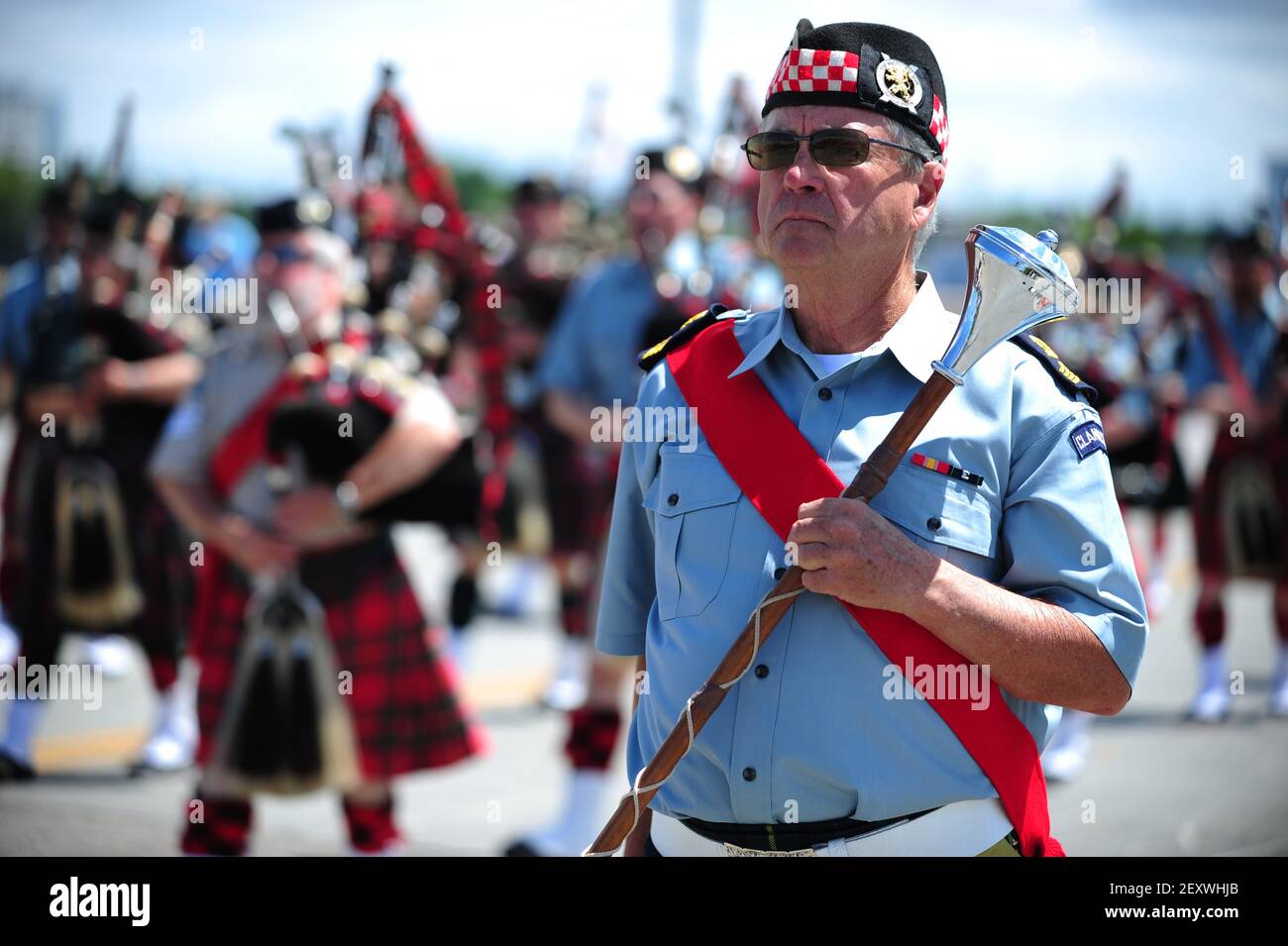 Bagpipe wielding men march across the Burnside Bridge during the Grand