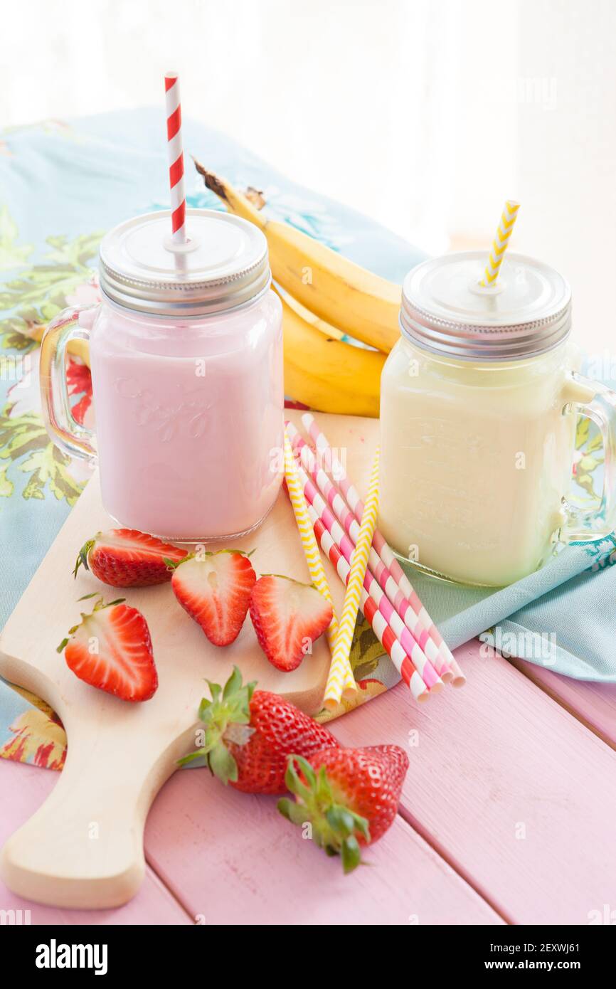 Milk with fresh strawberries and banana Stock Photo - Alamy