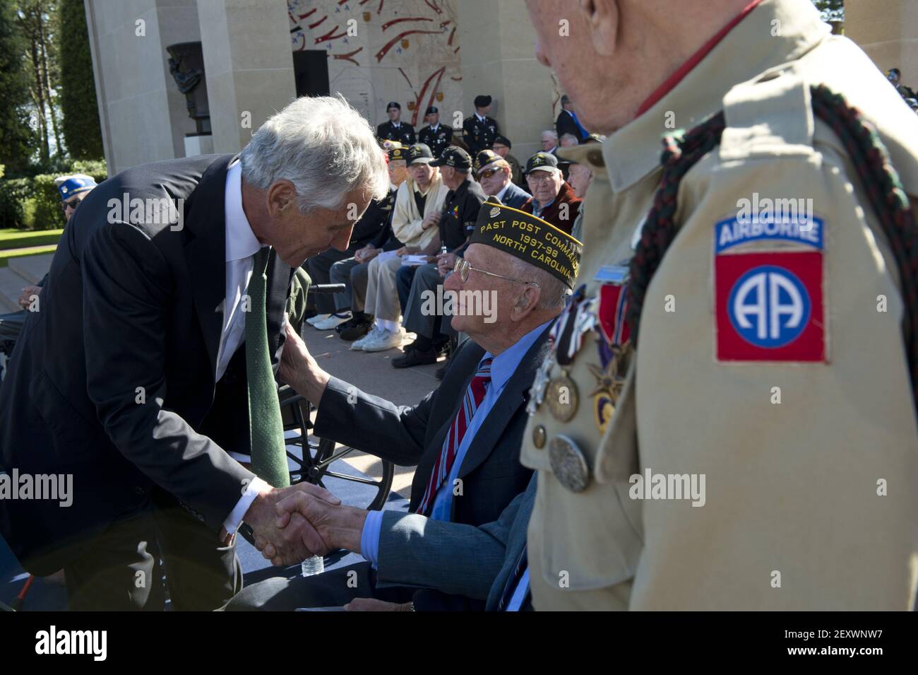 Secretary of Defense Chuck Hagel shakes hands with a US veteran at the 70th anniversary celebration of D-Day at Omaha Beach in Normandy, France on June 6, 2014. (Photo by Sgt. Aaron Hostutler/Department of Defense/Sipa USA) Stock Photo