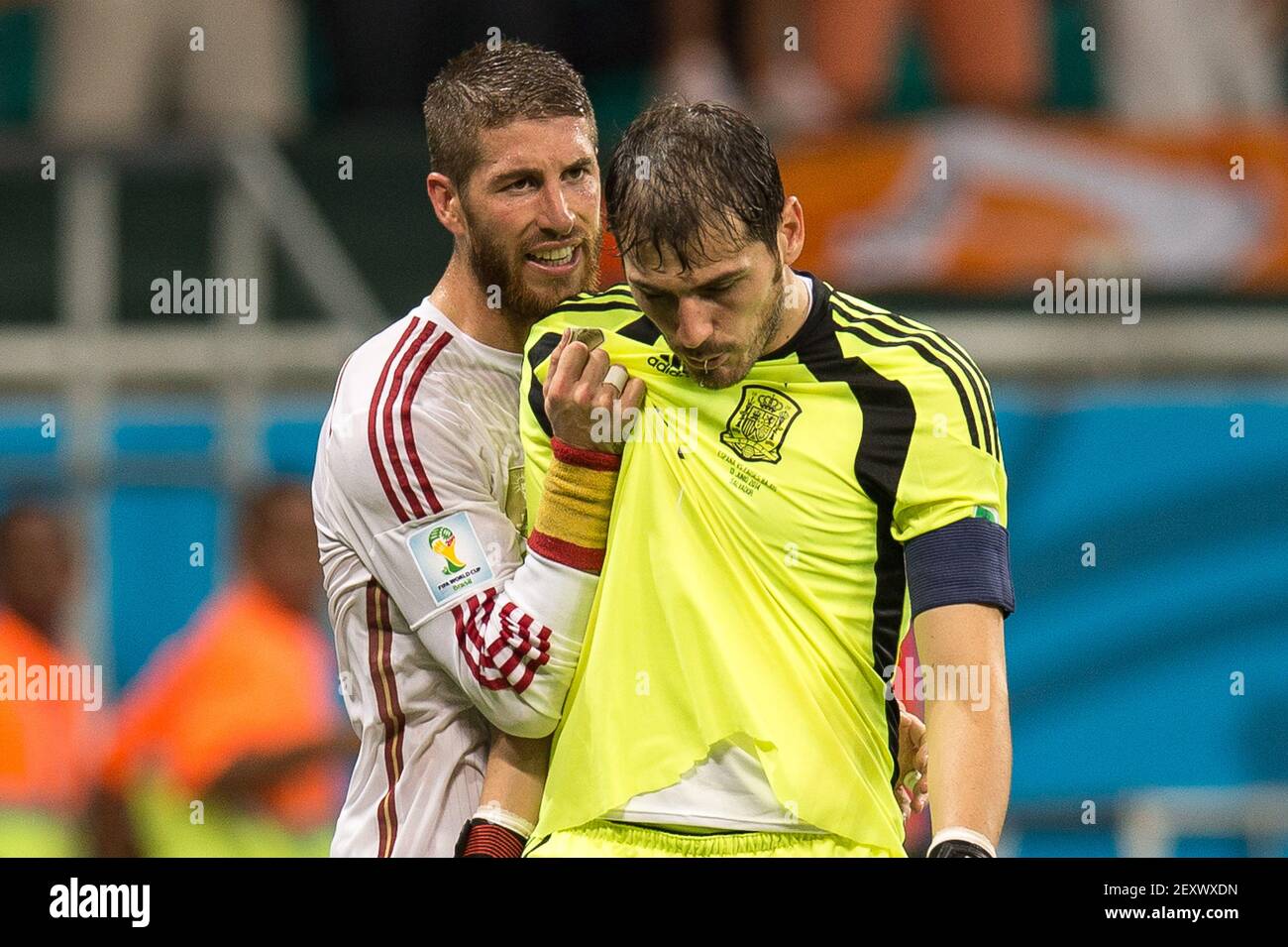 Spain's Sergio Ramos (L) tries to comfort goalkeeper Iker Casillas (R)  after Netherlands' won by 5-1 during the group B 2014 FIFA World Cup soccer  match between Spain and Netherlands, in Arena