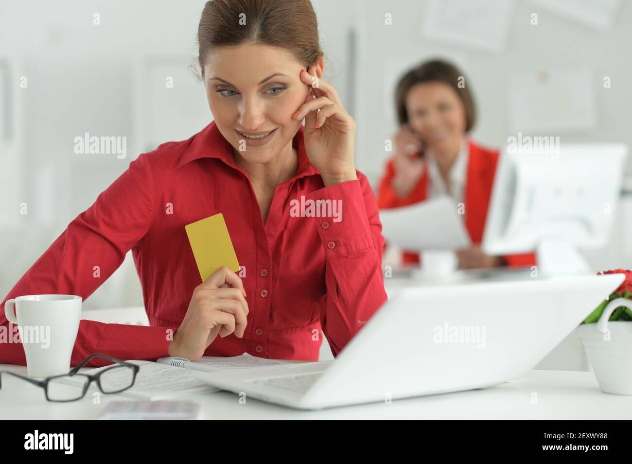 Businesswoman architect working in modern office with her colleague Stock Photo