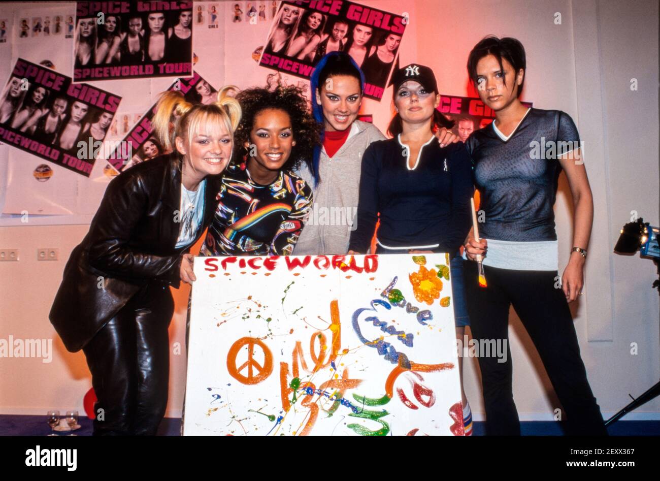 NIJMEGEN, THE NETHERLANDS- MAR 29, 1998: The spice girls with a painting that they just painted. It goes to an auction, the yield goes to charity. Stock Photo