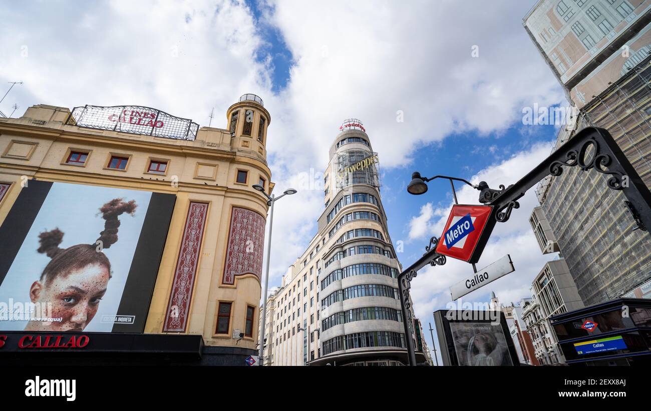 MADRID, SPAIN - Mar 04, 2021: Plaza de Callao, you can see the Carrion Building, Callao cinemas and the metro station. Stock Photo