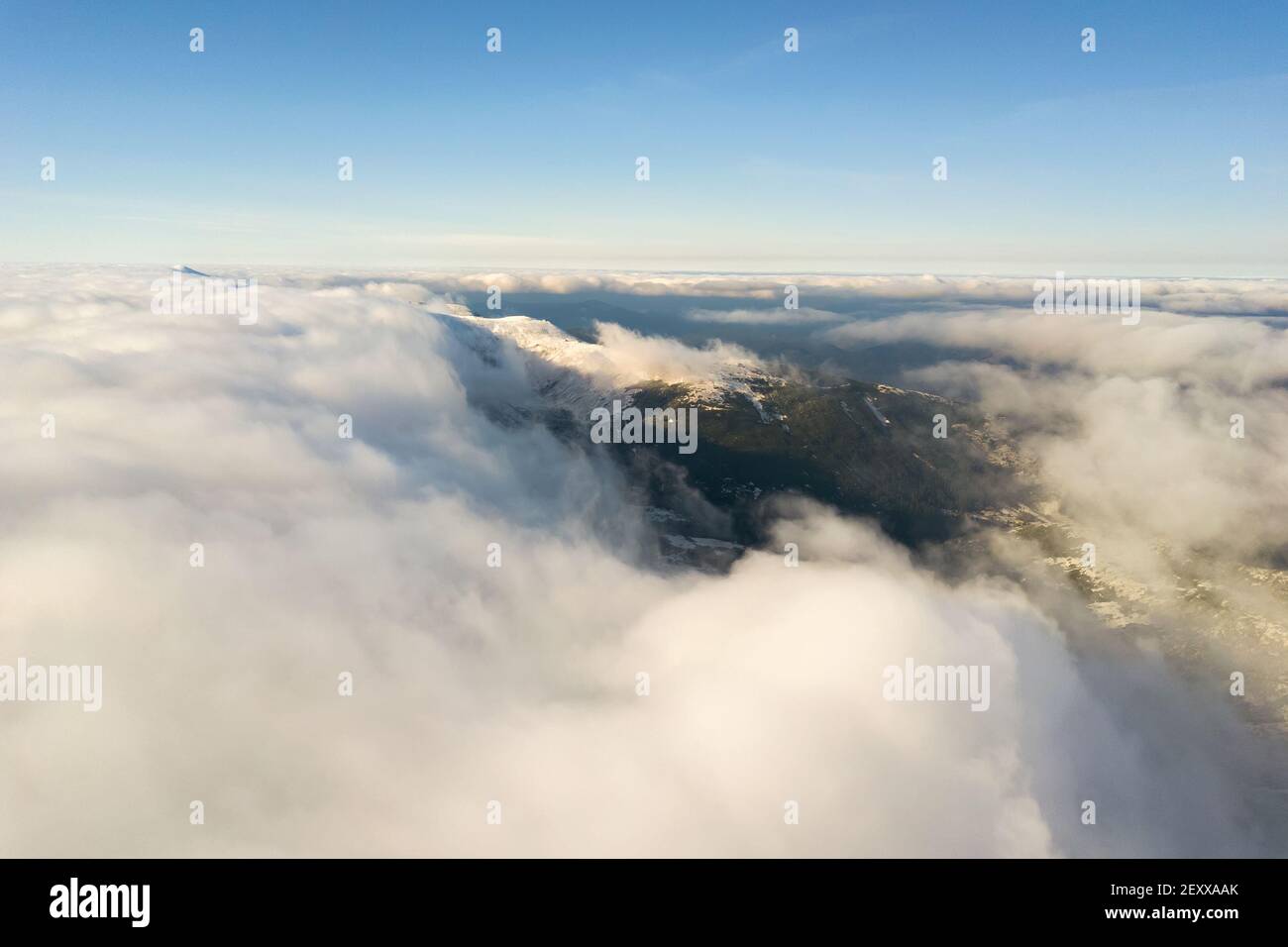 Aerial view flying through snowy hi-res stock photography and images ...