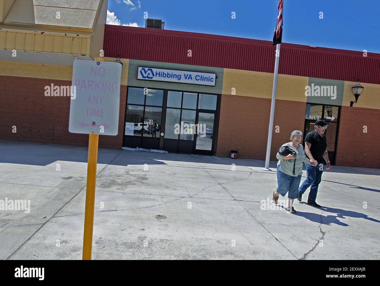 Jim and Pixie Hase made their way to the strip mall parking lot from a