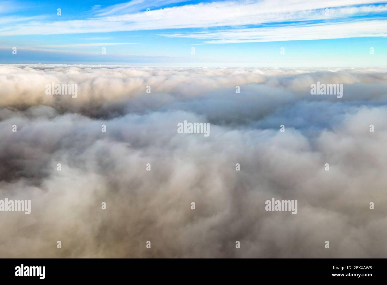 Aerial view from above of white puffy clouds in bright sunny day Stock ...