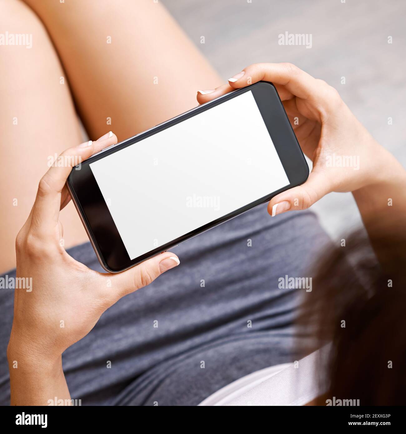 Woman hold black phablet device Stock Photo