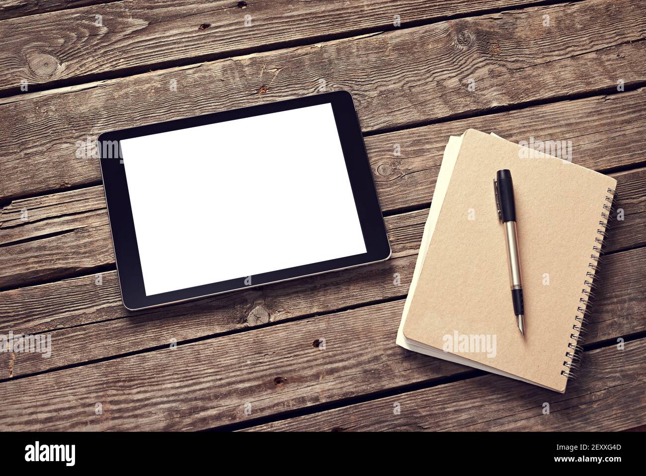 Tablet and notepad on desktop Stock Photo Alamy