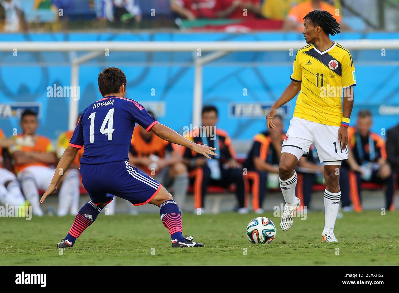 Japan's Toshihiro AOYAMA (L) vies with Colombia's Juan CUADRADO (R) during the group C 2014 FIFA World Cup soccer match between Japan and Colombia, in Arena Pantanal Stadium in Cuiaba, Brazil, on June 24, 2014. Photo by Dudu Macedo/Fotoarena/Sipa USA Stock Photo