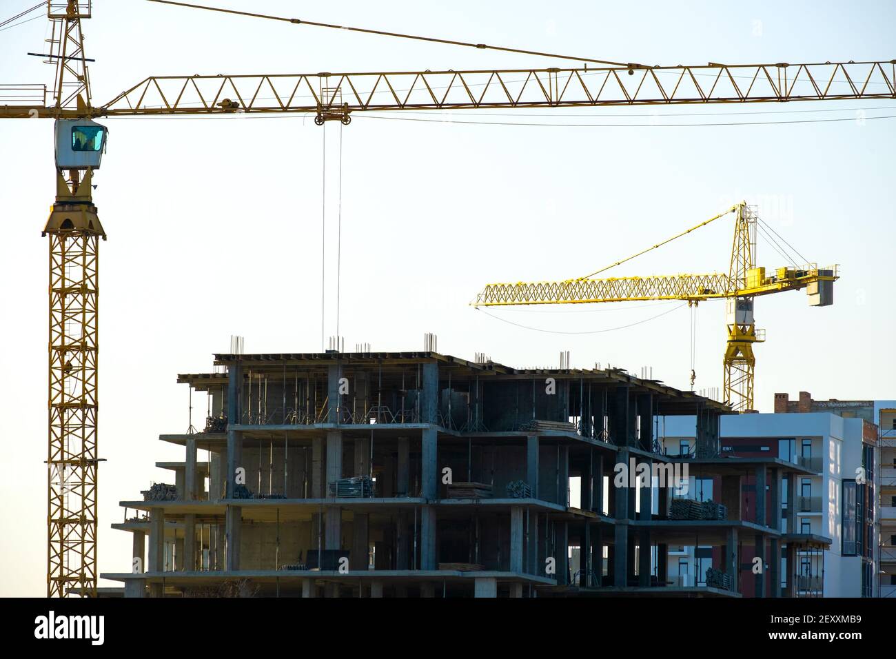 Aerial view of tower cranes and high residential apartment buildings ...