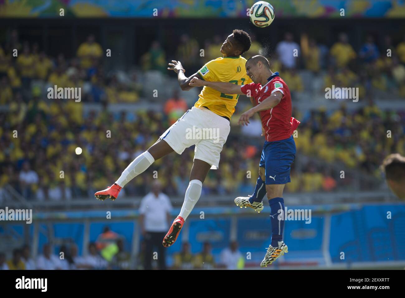 Brazil's JO (L) heads the ball with Chile's FRANCISCO SILVA GAJARDO (R) during the Round of 16 of the 2014 FIFA World Cup soccer match between Brazil and Chile, in Mineirao Stadium in Belo Horizonte, Brazil, on June 28, 2014. Photo by Jorge Martinez/MEXSPORT/Fotoarena/Sipa USA Stock Photo