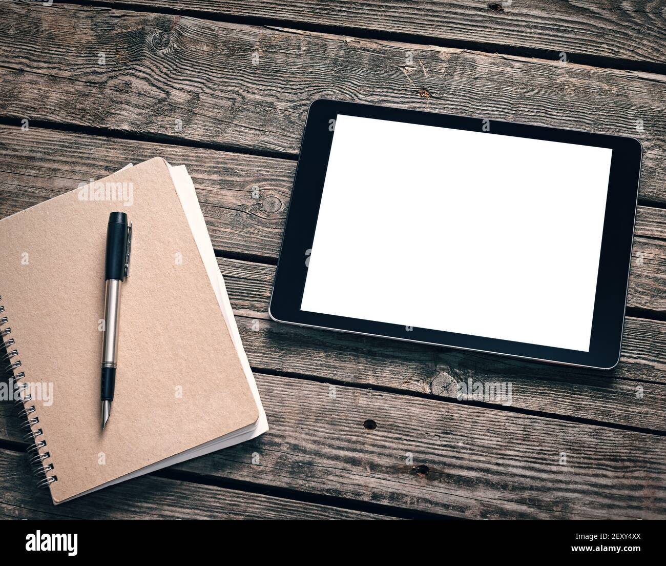 Tablet with ring binder on desktop Stock Photo