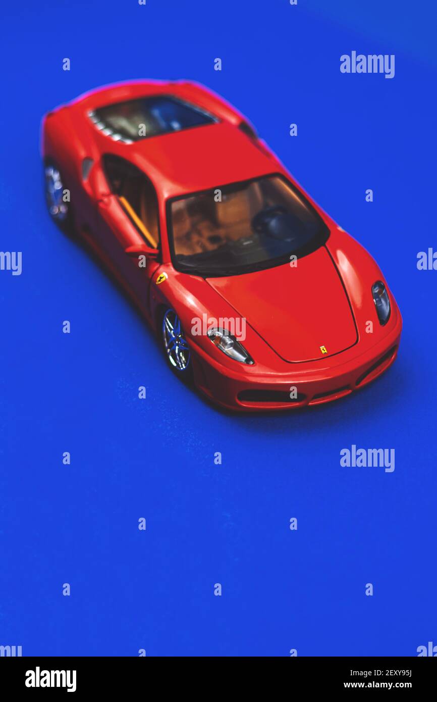 Kharkov, Ukraine - February 24, 2021: Sport car toy Ferrari model F430 Spider on a blue background, photo Stock Photo