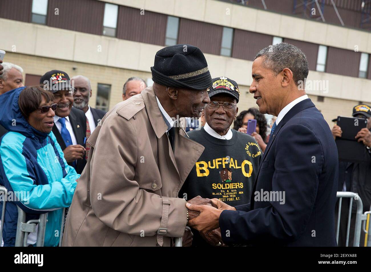 President Barack Obama greets 93-year-old Sanders H. Matthews, Sr., a retired U.S. Army Staff Sergeant and 'buffalo soldier,' at Stewart Air National Guard Base prior to departure from Newburgh, New York, May 28, 2014. (Photo by Pete Souza/White House/Sipa USA) This official White House photograph is being made available only for publication by news organizations and/or for personal use printing by the subject(s) of the photograph. The photograph may not be manipulated in any way and may not be used in commercial or political materials, advertisements, emails, products, promotions that in any  Stock Photo
