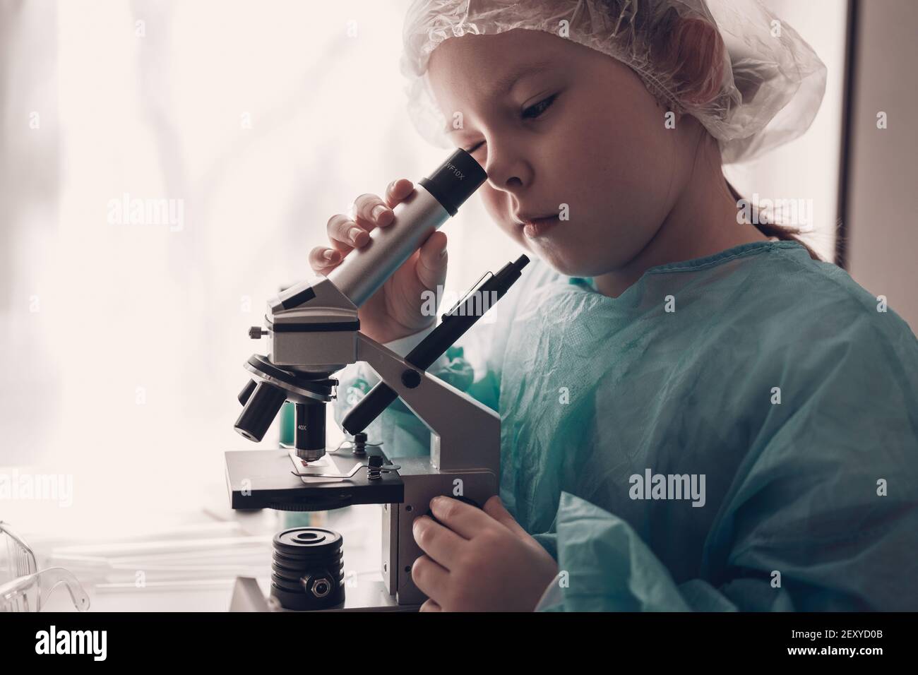 Girl in lab coat hi-res stock photography and images - Alamy