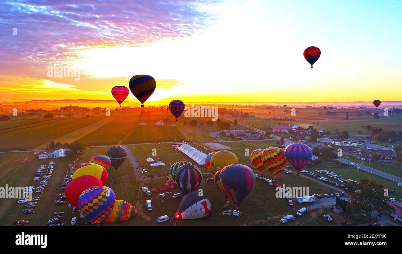Hot Air Balloons Taking Off at Sunrise at a Hot Air Balloon Festival on