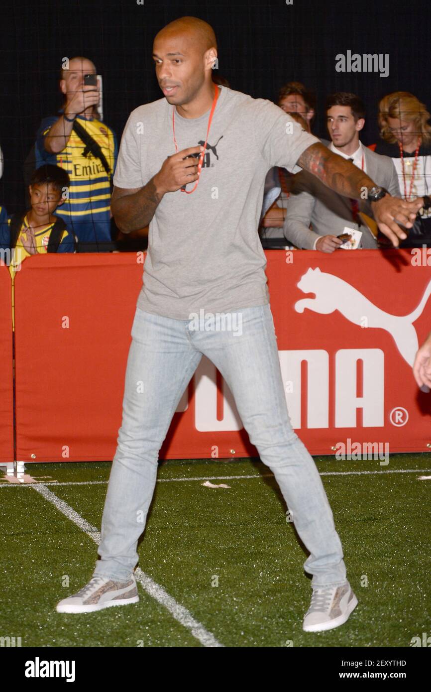 Former french soccer player Thierry Henry participate in Puma sponsored  game with Arsenal players against regional junior soccer league champions  in Grand Central Terminal in New York, NY, on July 25, 2014. (
