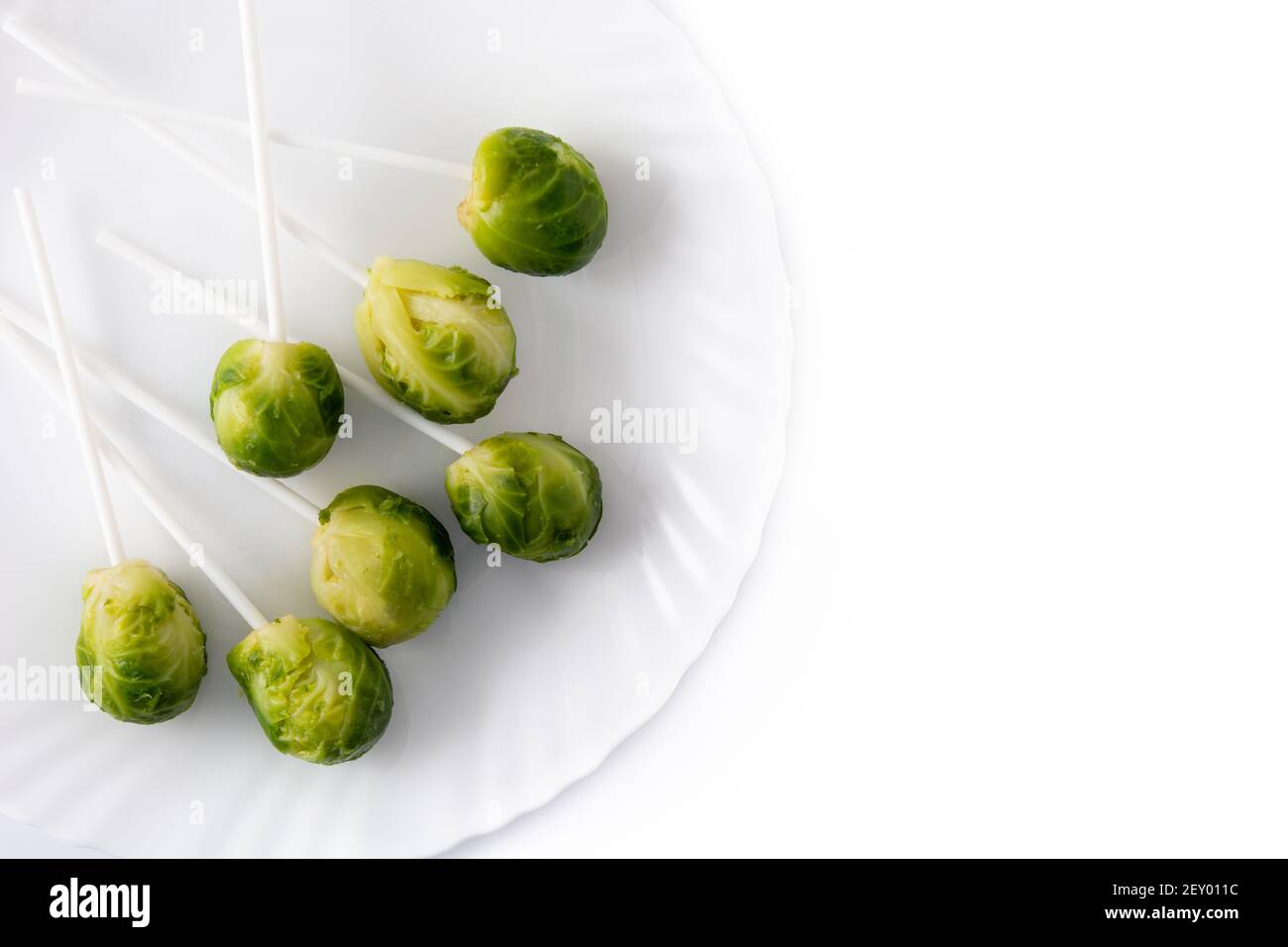 Set of brussel sprouts with lollipop sticks isolated on white