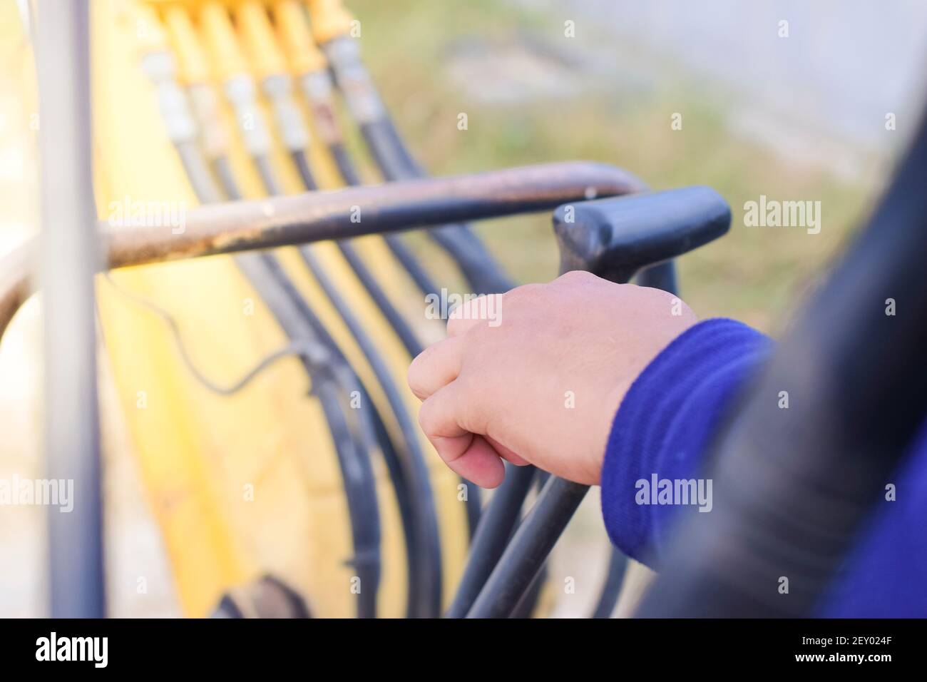 A man hand is controlling a backhoe, building contractor. Stock Photo