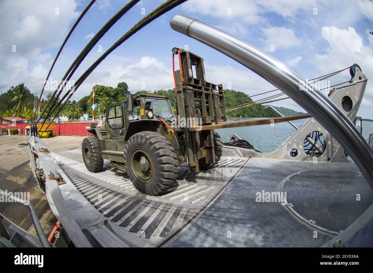 U.S. military and civilian personnel assigned to the joint high speed vessel USNS Spearhead (JHSV 1) work on unloading equipment from the ship in Puerto Barrios, Guatemala, July 22, 2014, during Southern Partnership Station (SPS) 2014. SPS is an annual deployment of U.S. ships to the U.S. Southern Command's area of responsibility in the Caribbean and Latin America. The exercise involves information sharing with navies, coast guards and civilian services throughout the region. (Photo by Mass Communication Specialist 3rd Class Andrew Schneider, U.S. Navy/DoD/Sipa USA) Stock Photo