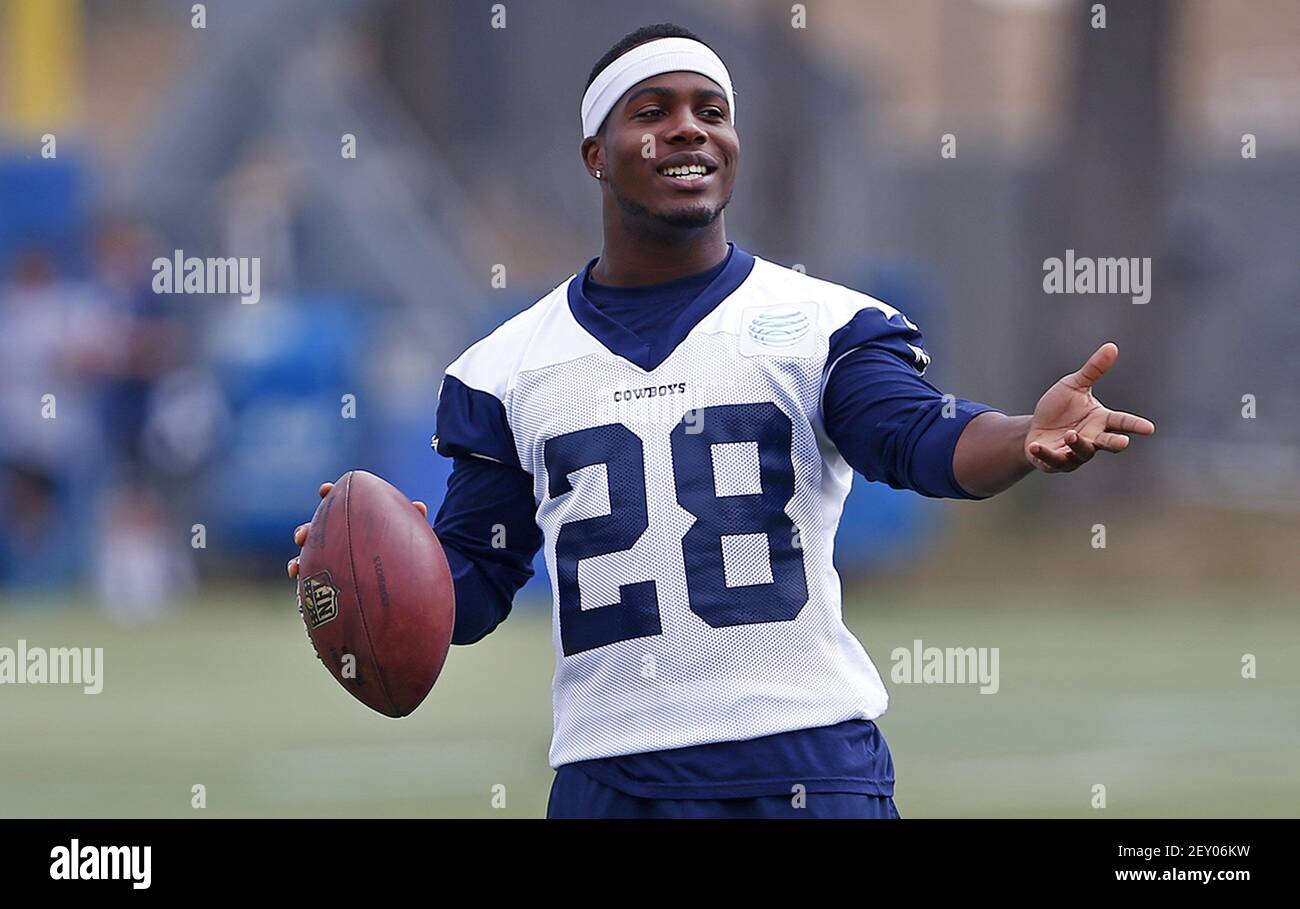 Dallas Cowboys running back Ben Malena laughs with a teammate 
