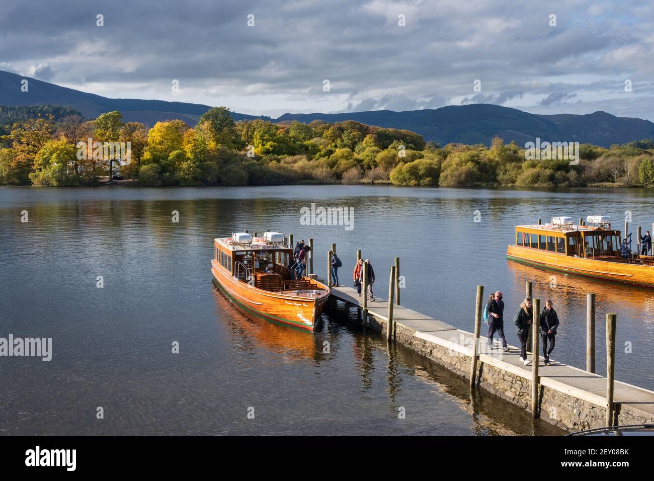 Passengers disembark from Derwent Launch Co ferry boat at Lakeside Park Jetty on Derwentwater Keswick in the English Lake District Cumbria Stock Photo