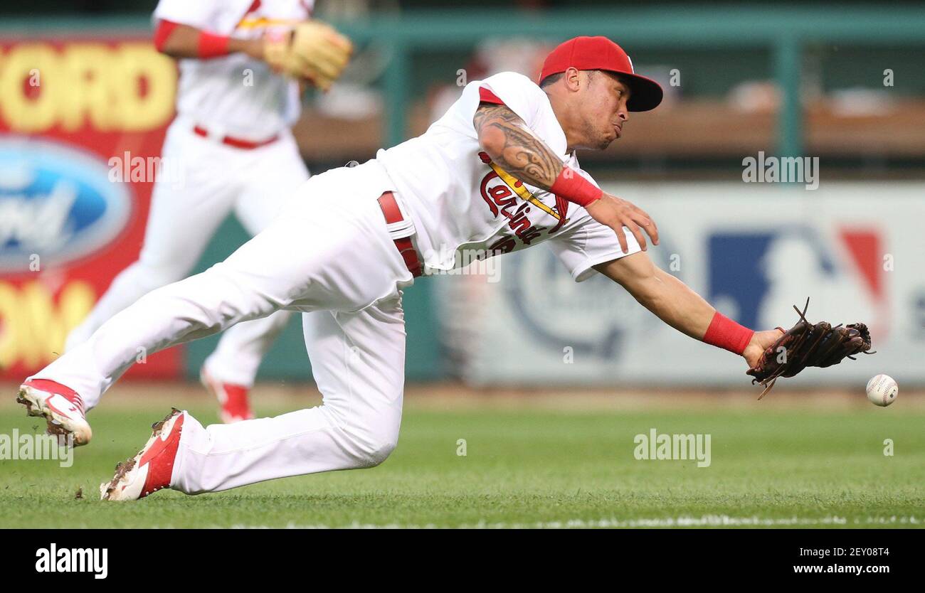 St. Louis Cardinals second baseman Kolten Wong is unable to reach a triple off the bat of the