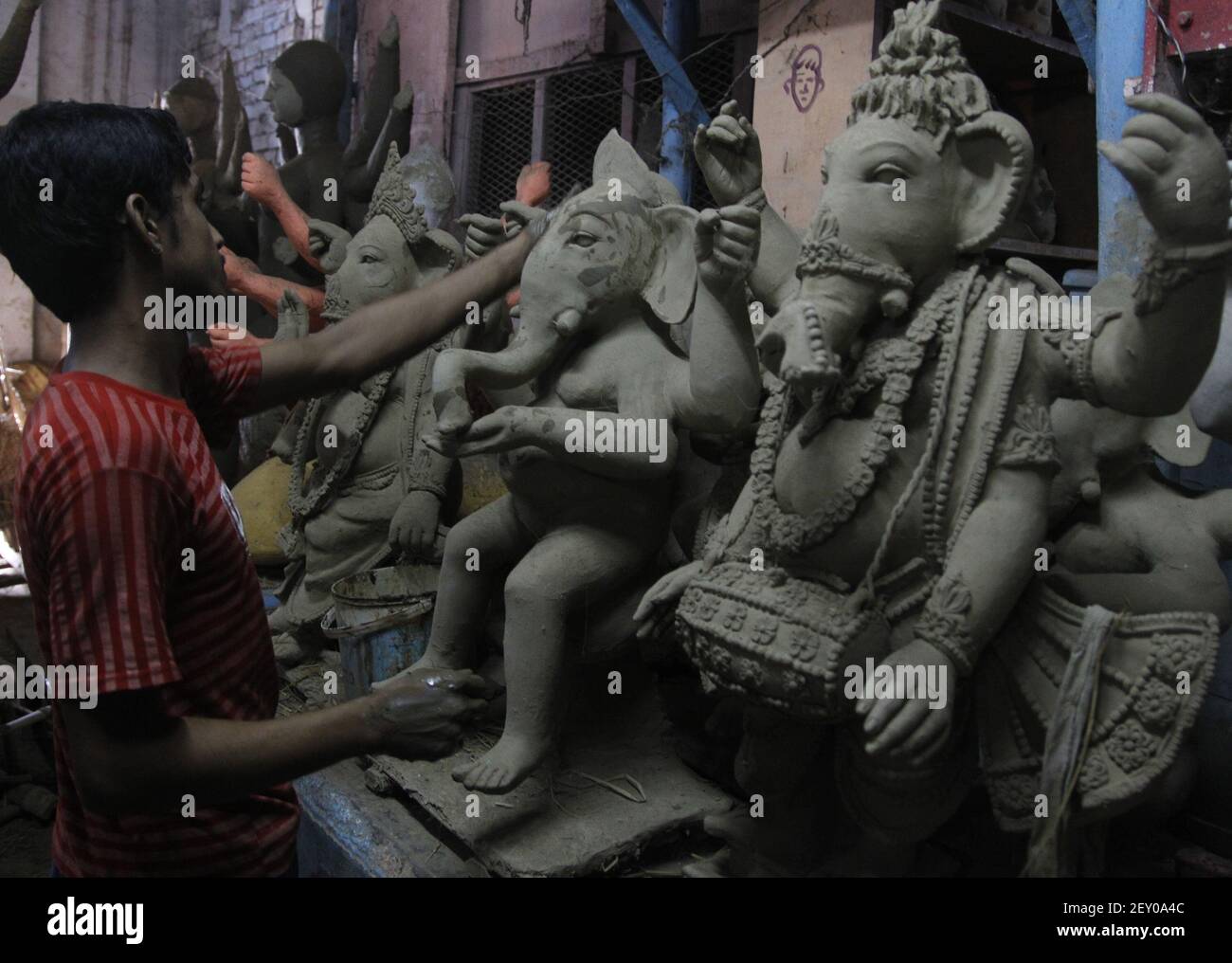 An artist makes statues of Lord Ganesh ahead of "Ganesh festival" in a in Allahabad